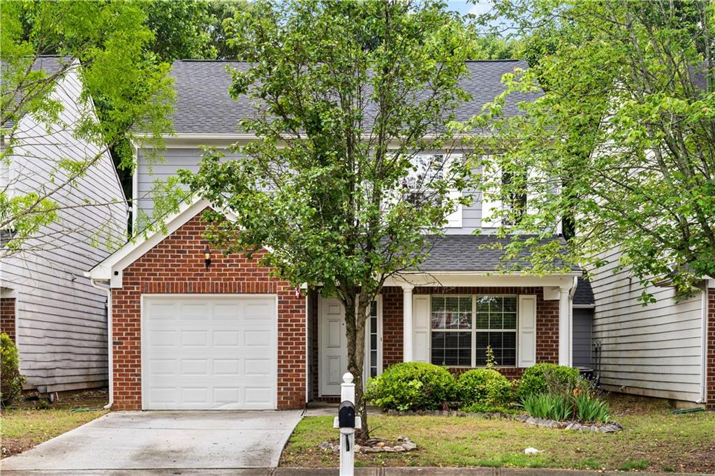 2365 Charleston Pointe Southeast Atlanta, GA 30316 - Photo 1 of 1 front view of a house and a yard