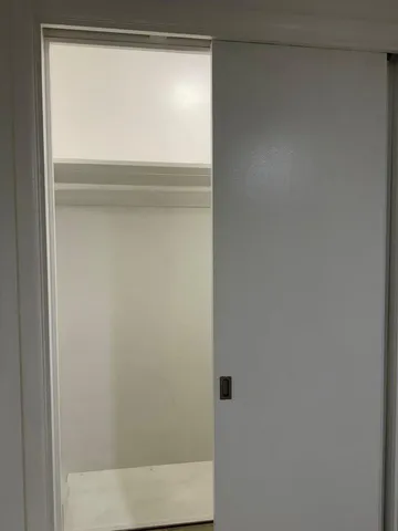 a bathroom with a glass shower door