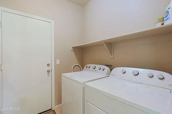 a utility room with dryer and washer