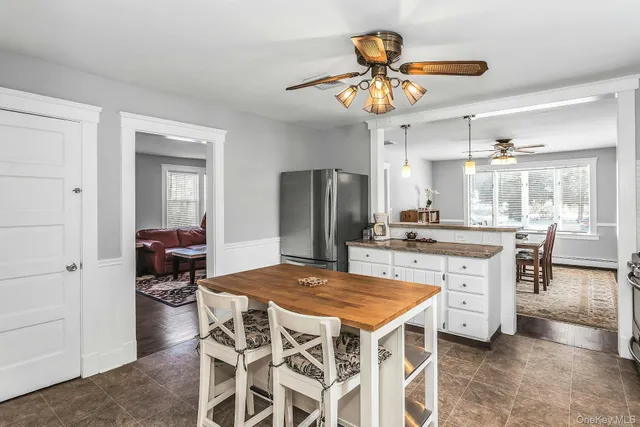 a kitchen with a table and chairs