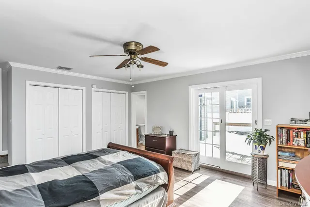 a bedroom with a bed furniture and a window