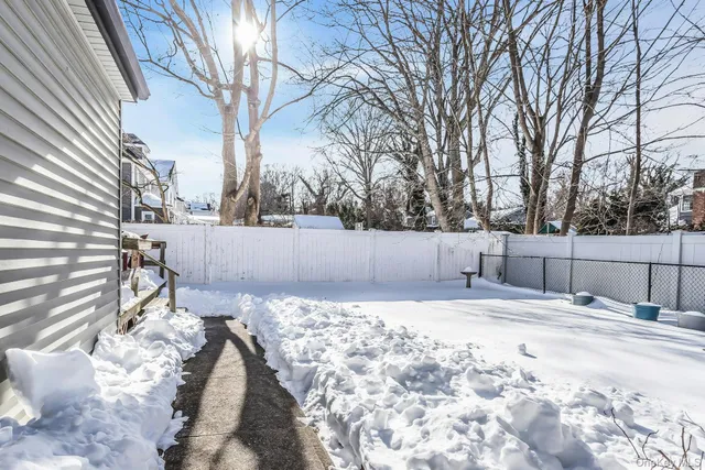 a view of a backyard of the house