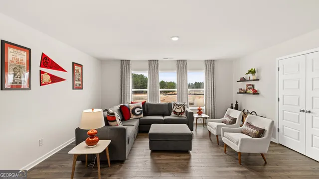 a large kitchen with stainless steel appliances granite countertop a stove a sink and a wooden floors