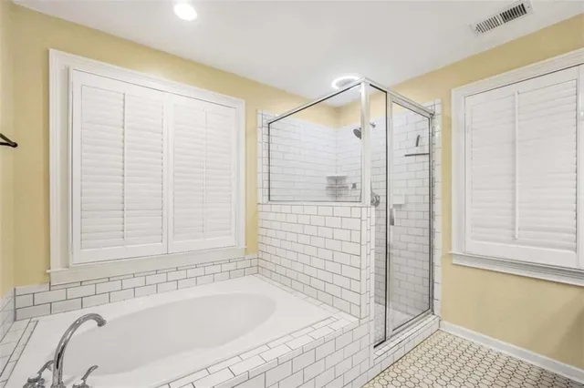 a view of a livingroom with a ceiling fan and window