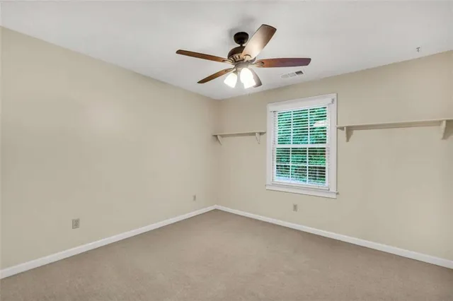 a view of a roof deck with wooden fence and floor
