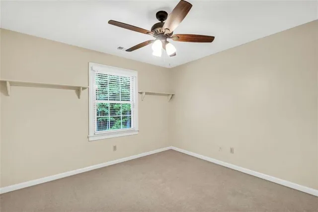 an aerial view of a house with outdoor space and a lake view