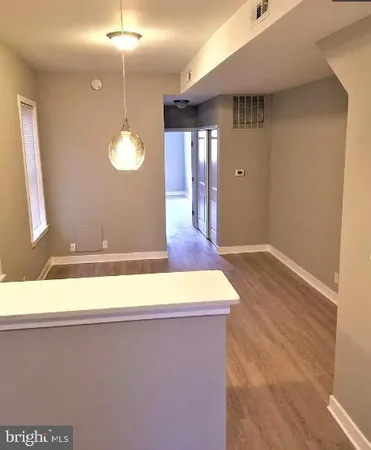 a view of a livingroom with wooden floor