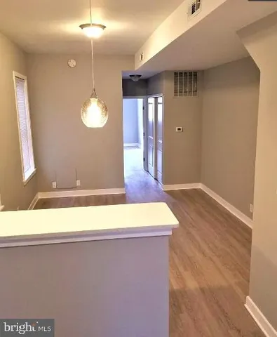 a view of a livingroom with wooden floor