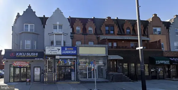 a view of a cafe with outdoor seating