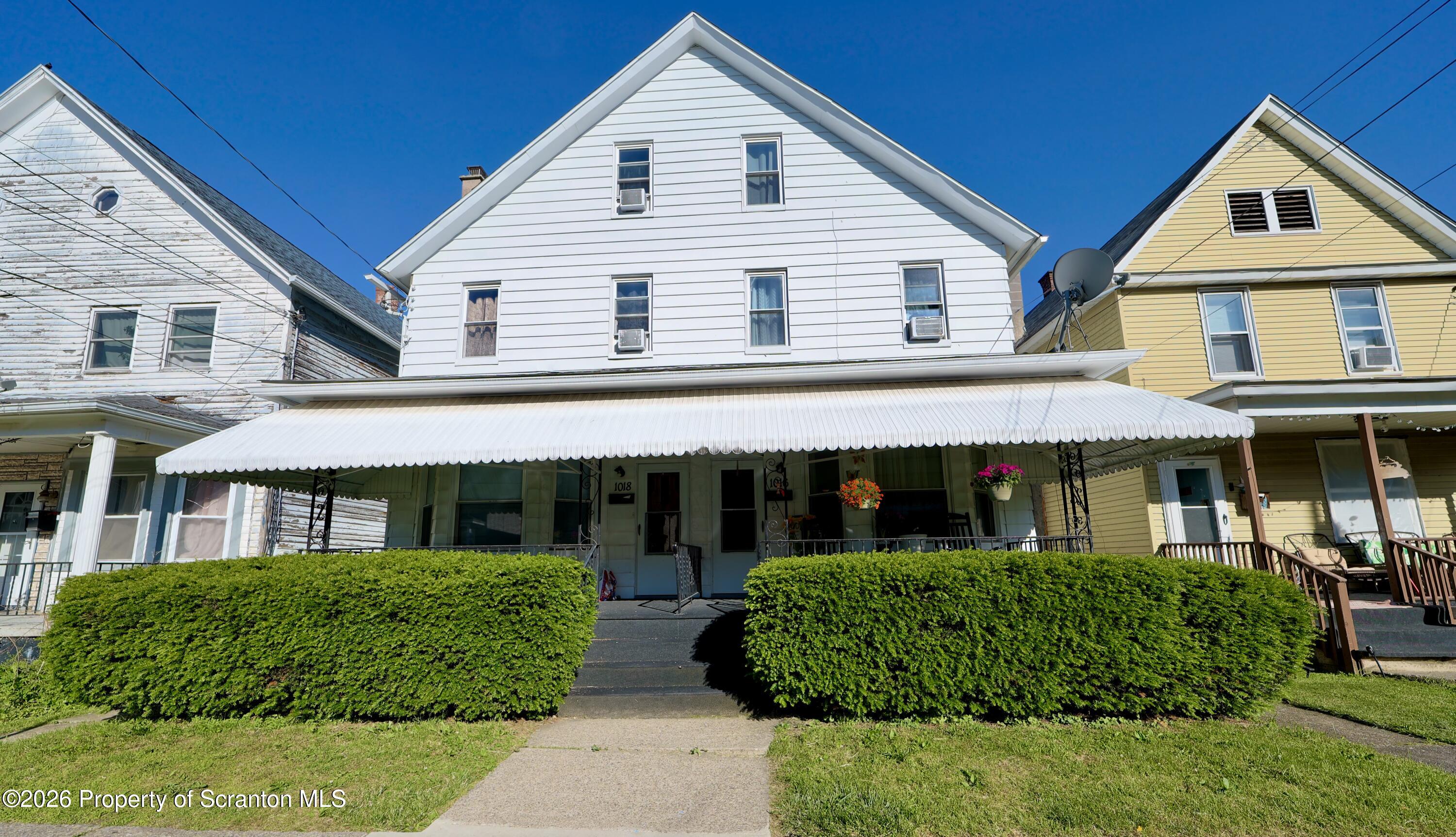 1016-1018 Diamond Avenue Scranton, PA 18508 - Photo 1 of 15 a front view of a house with a yard