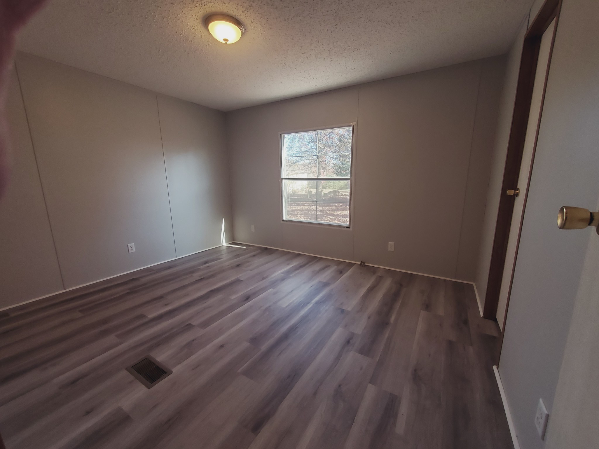 1108 Turkey Creek Road Dickson, TN 37055 - Photo 12 of 12 an empty room with wooden floor and windows