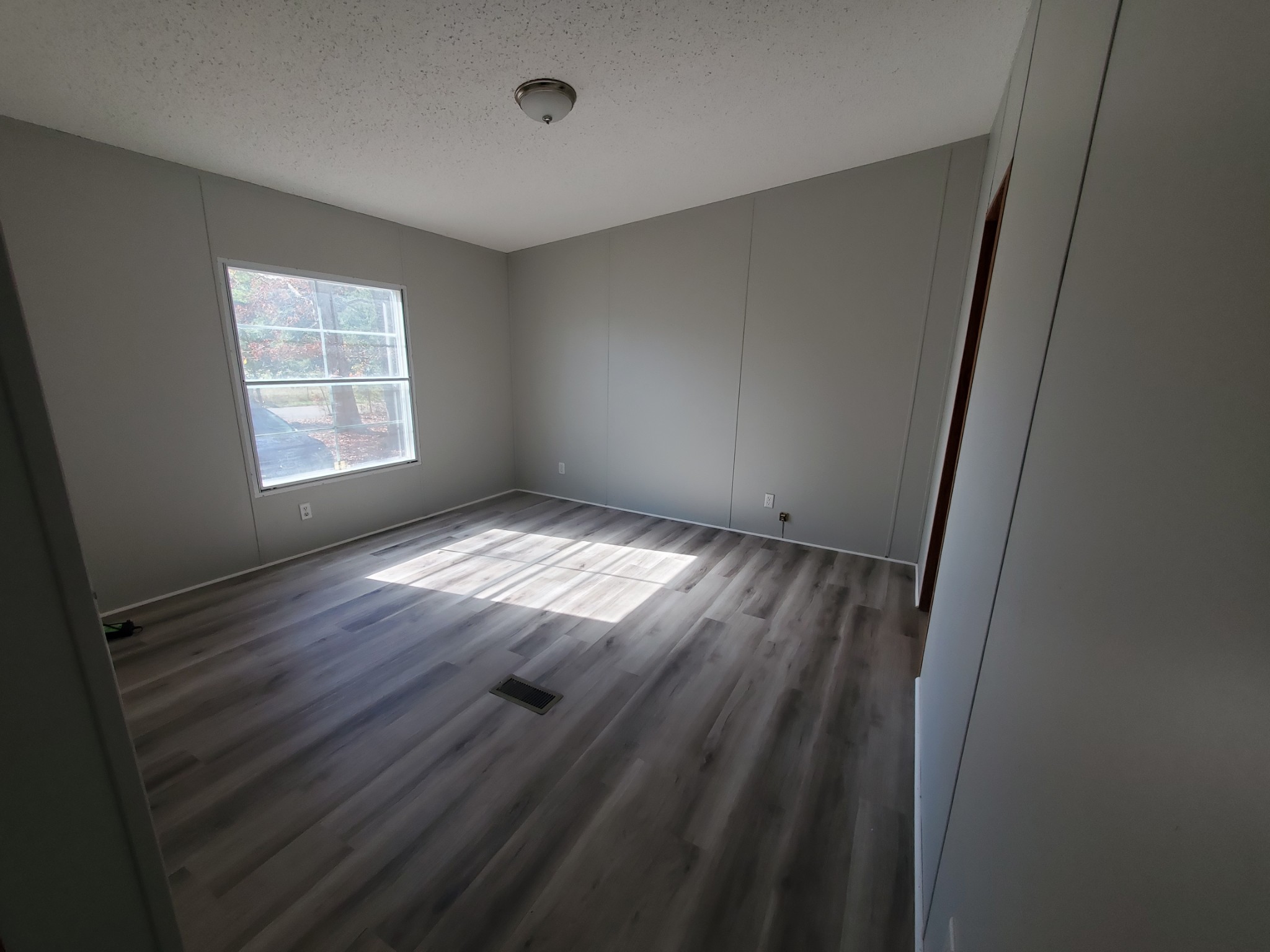1108 Turkey Creek Road Dickson, TN 37055 - Photo 10 of 12 a view of empty room with wooden floor and fan