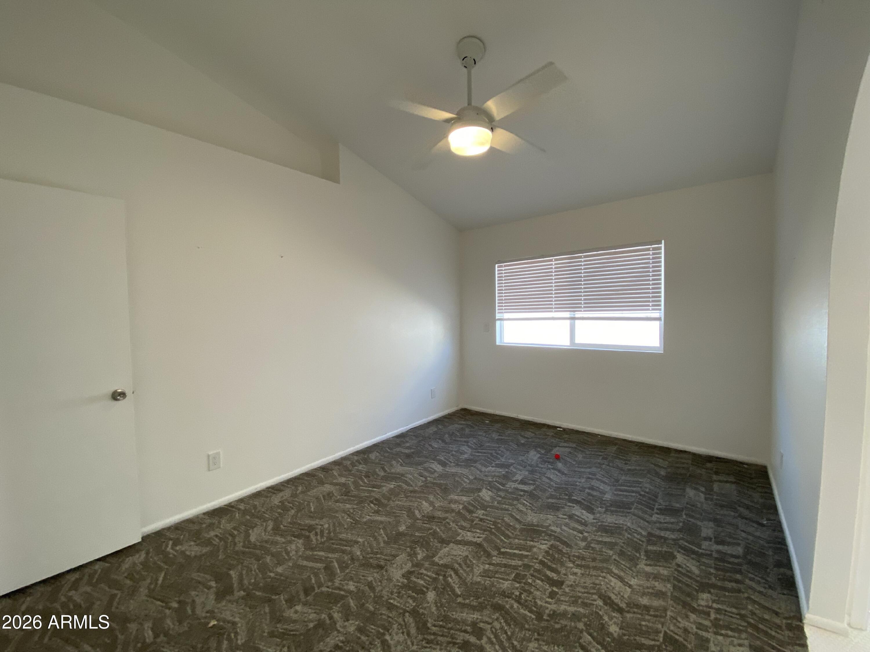 1055 North Recker Road, Unit 1196 Mesa, AZ 85205 - Photo 20 of 42 en empty room with windows