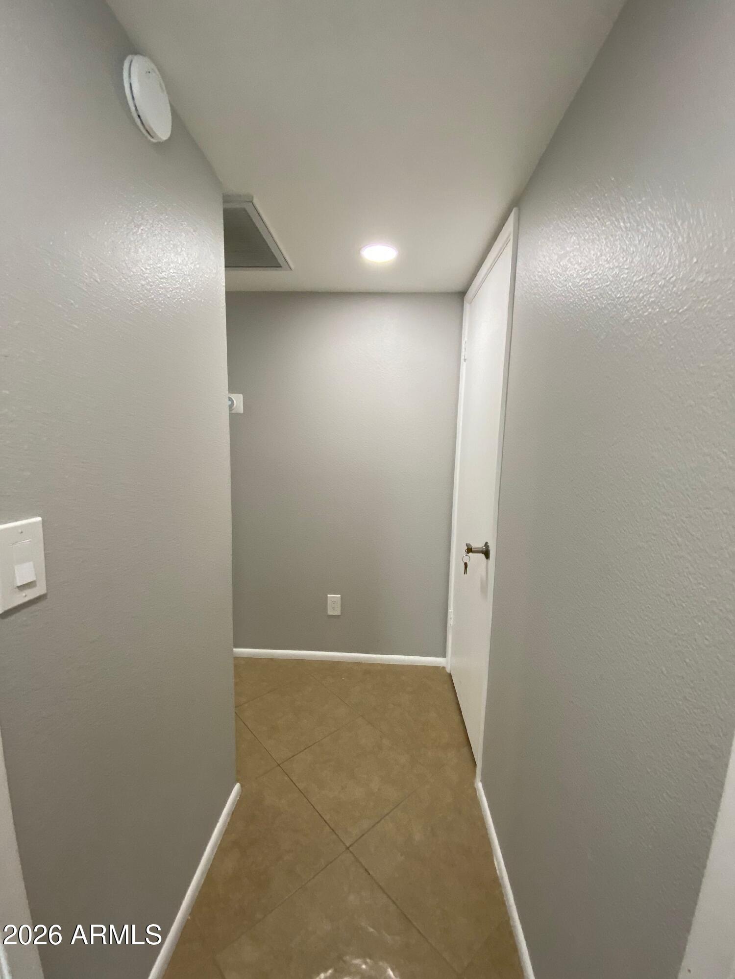 1055 North Recker Road, Unit 1196 Mesa, AZ 85205 - Photo 35 of 42 a view of hallway
