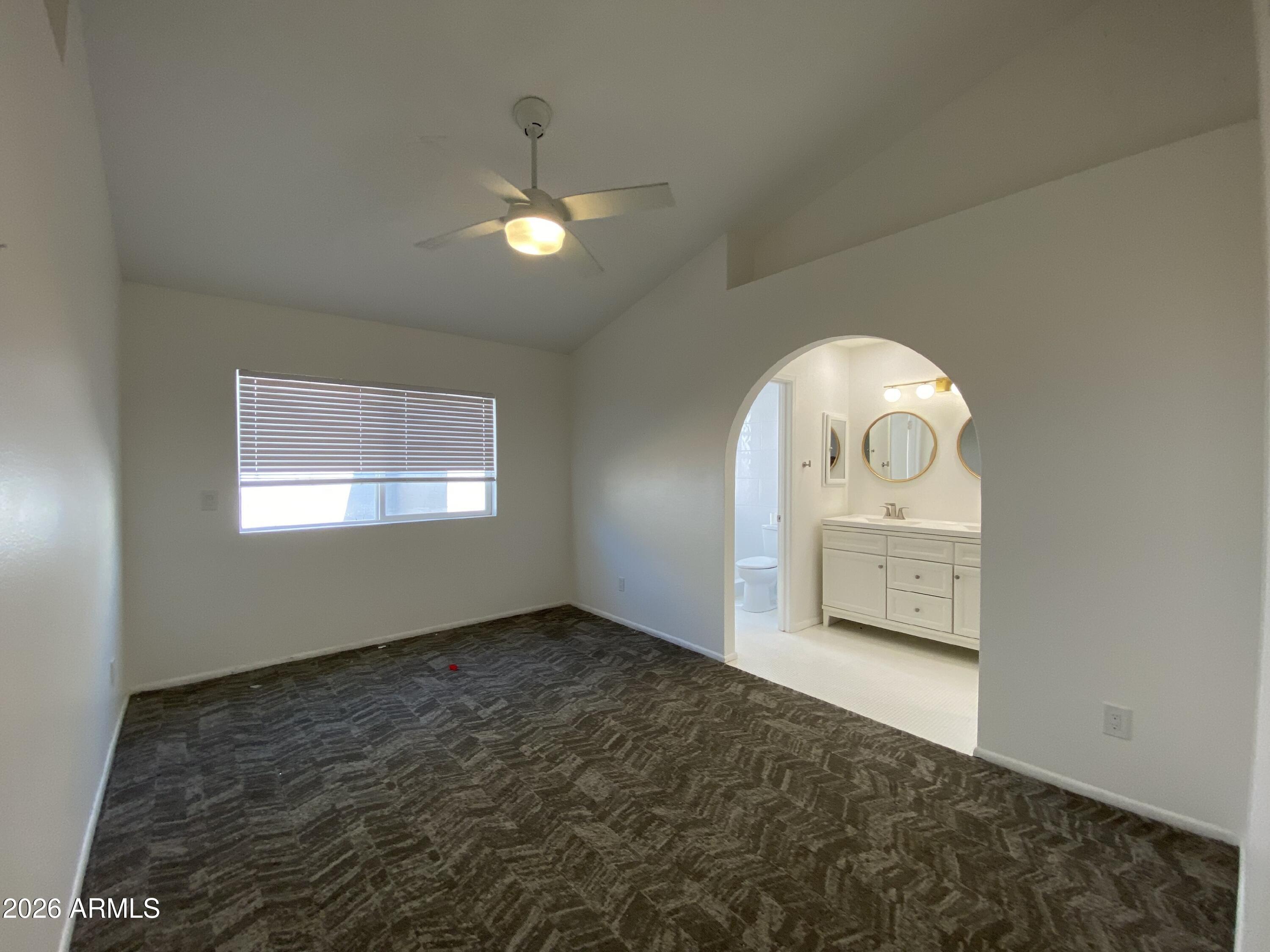 1055 North Recker Road, Unit 1196 Mesa, AZ 85205 - Photo 9 of 42 a view of a room with a staircase
