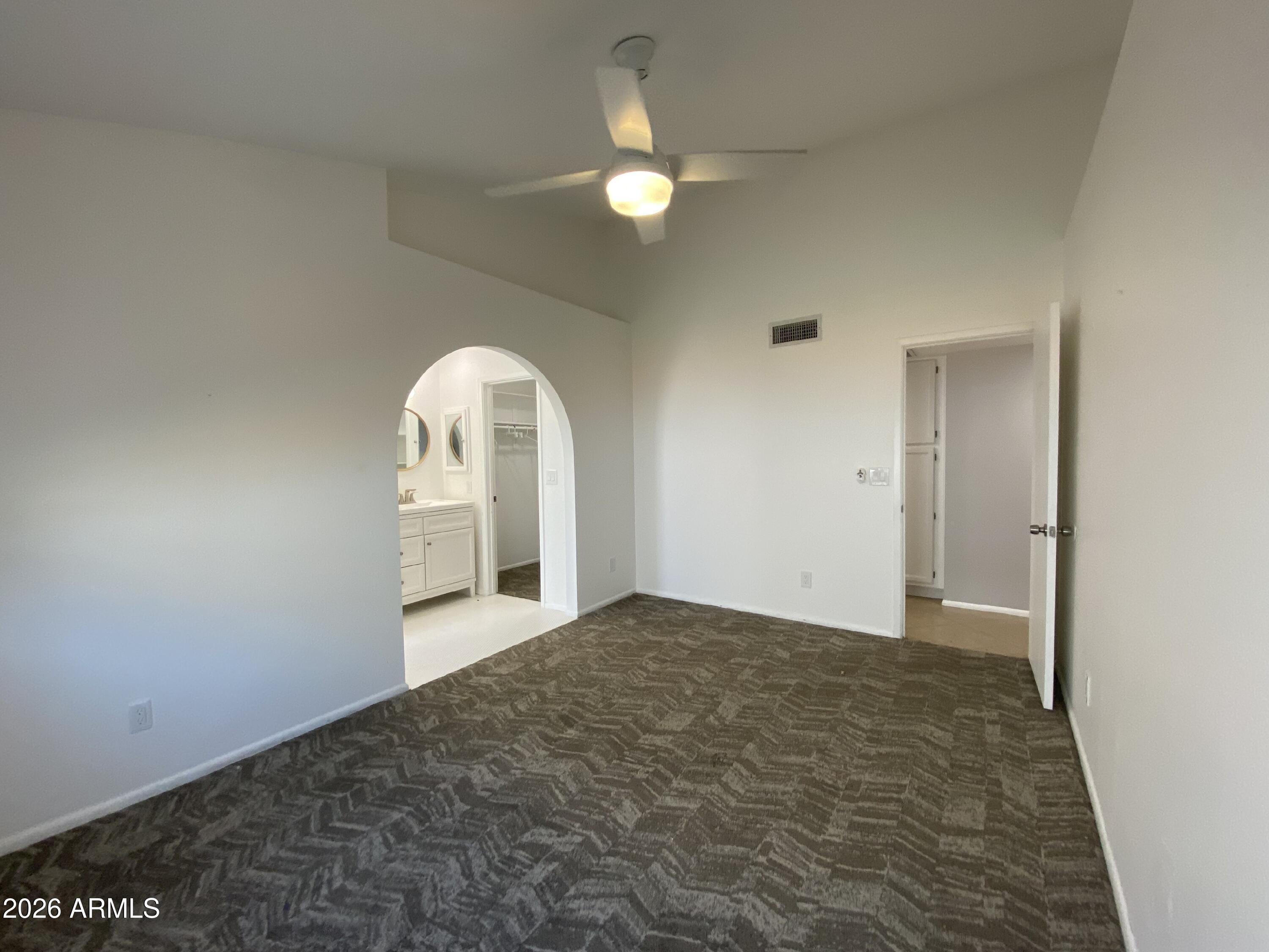 1055 North Recker Road, Unit 1196 Mesa, AZ 85205 - Photo 10 of 42 a view of an empty room and window