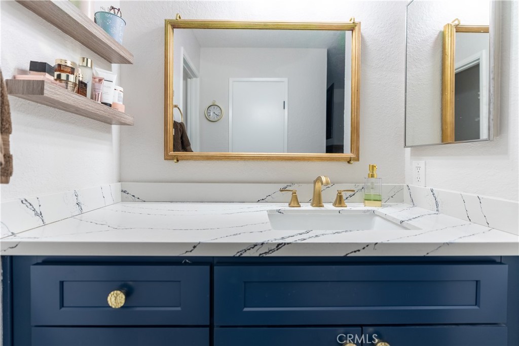 10328 Ivy Court Rancho Cucamonga, CA 91730 - Photo 12 of 40 a bathroom with a sink and a mirror