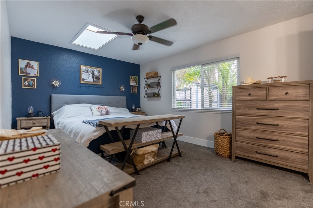 10328 Ivy Court Rancho Cucamonga, CA 91730 - Photo 15 of 40 a bedroom with a bed and a chandelier