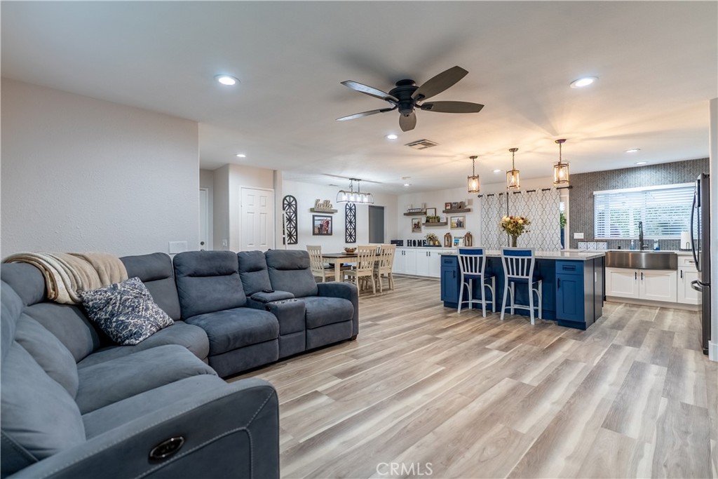 10328 Ivy Court Rancho Cucamonga, CA 91730 - Photo 27 of 40 a living room with furniture and kitchen view