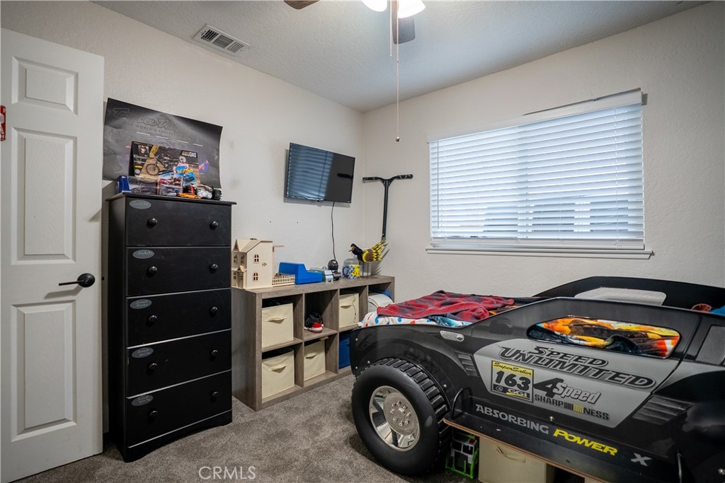 10328 Ivy Court Rancho Cucamonga, CA 91730 - Photo 10 of 40 a bedroom with a bed and a tv
