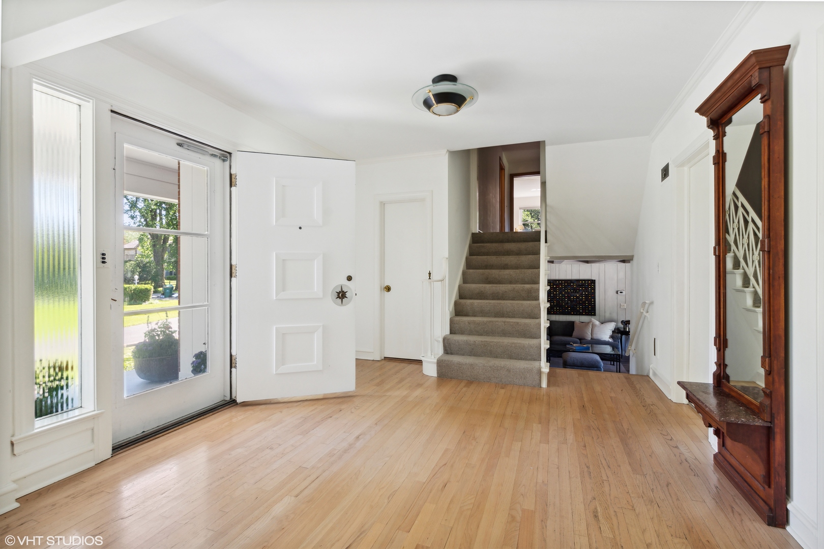 54 Meadowview Road Northfield, IL 60093 - Photo 3 of 32 a view of a livingroom with wooden floor and stairs