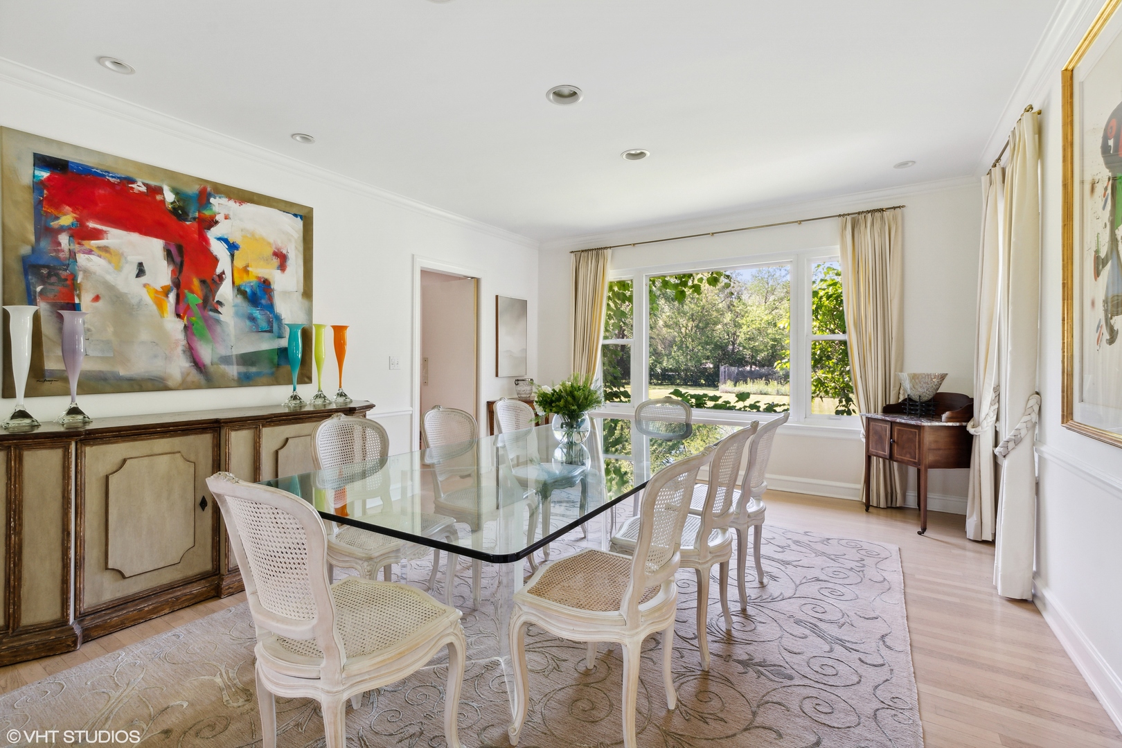 54 Meadowview Road Northfield, IL 60093 - Photo 7 of 32 a dining room with furniture a rug and a floor to ceiling window