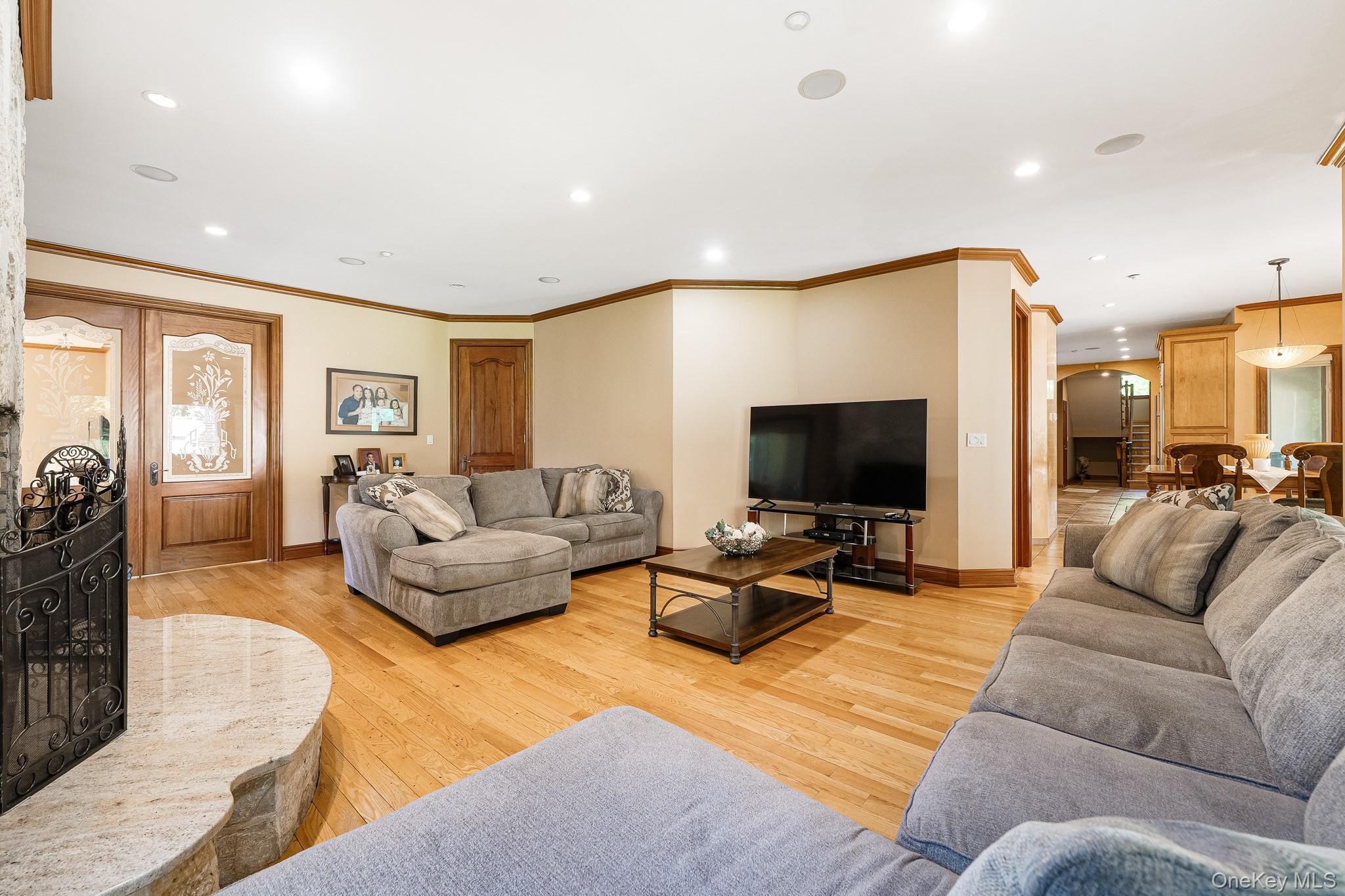 33 Winding Rd Farm Ardsley, NY 10502 - Photo 11 of 50 Living area featuring light wood-style flooring, recessed lighting, and crown molding