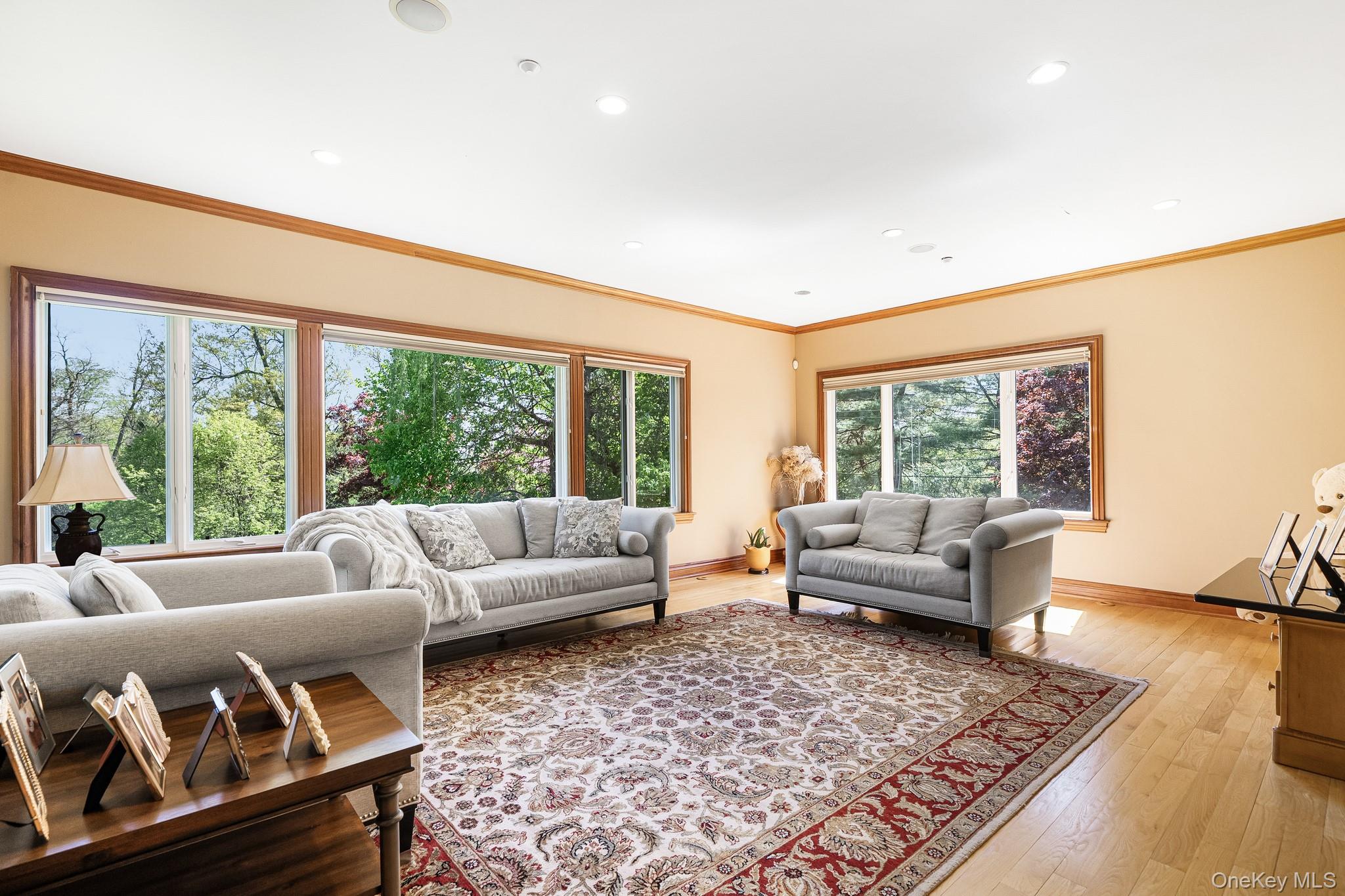 33 Winding Rd Farm Ardsley, NY 10502 - Photo 12 of 50 Living room featuring light wood-style floors, crown molding, and recessed lighting
