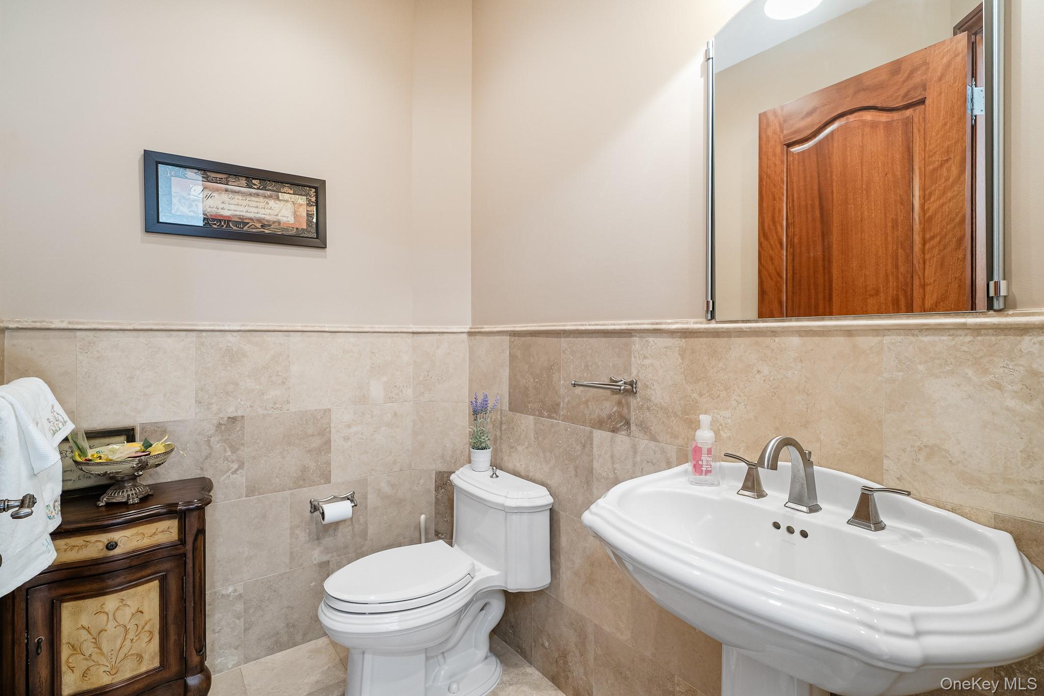 33 Winding Rd Farm Ardsley, NY 10502 - Photo 16 of 50 Bathroom with wainscoting and tile walls