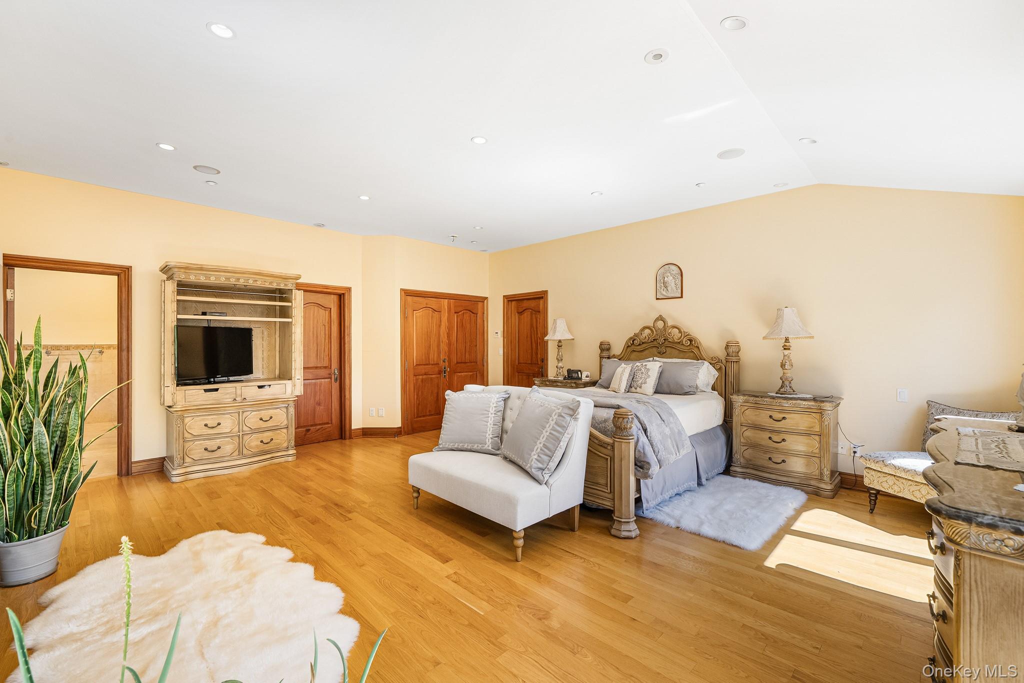33 Winding Rd Farm Ardsley, NY 10502 - Photo 18 of 50 Bedroom featuring light wood finished floors, vaulted ceiling, and recessed lighting