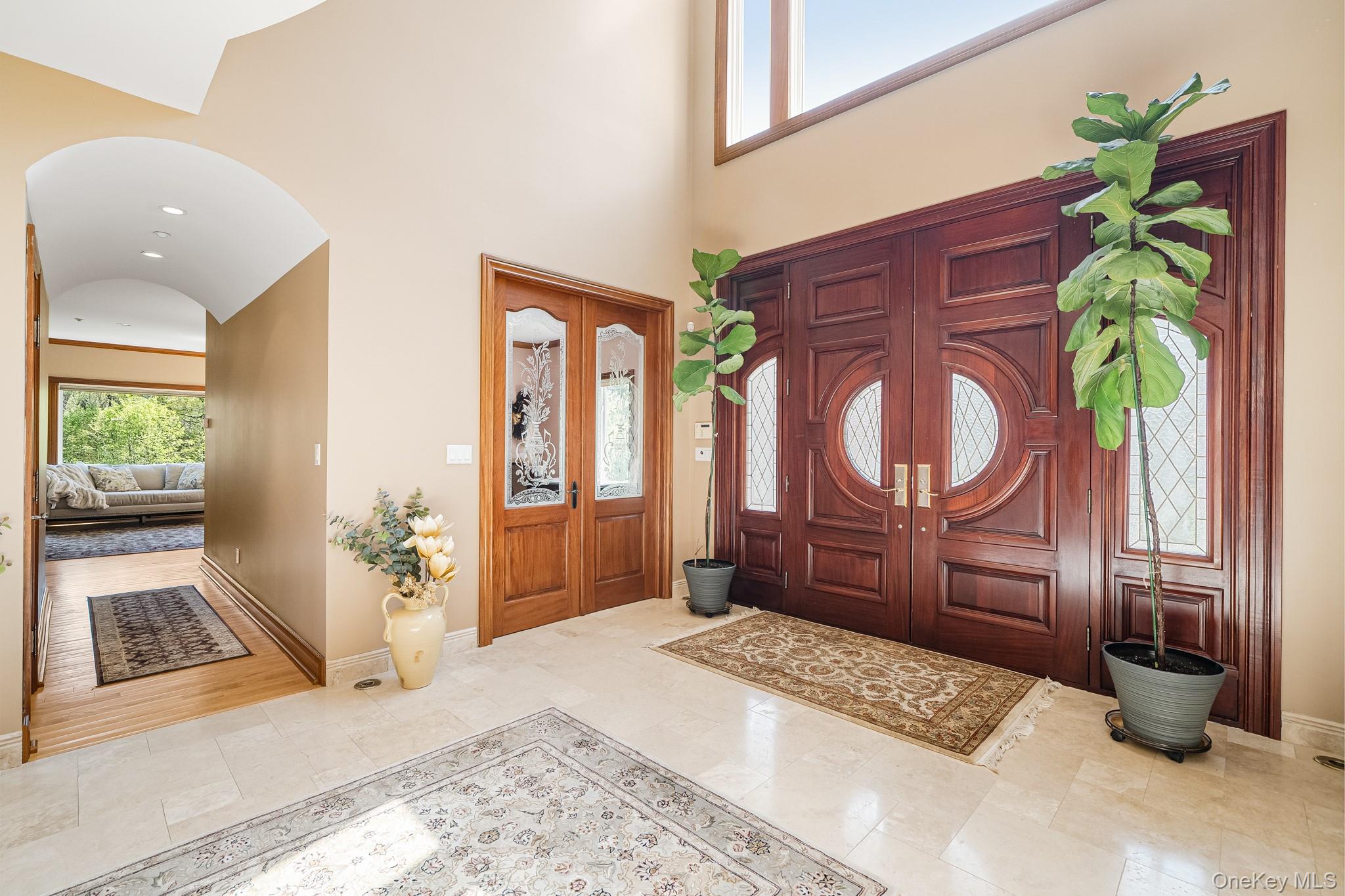 33 Winding Rd Farm Ardsley, NY 10502 - Photo 2 of 50 Foyer featuring arched walkways and high vaulted ceiling