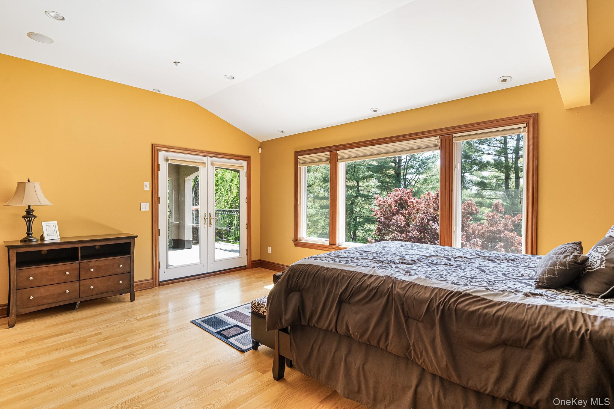 33 Winding Rd Farm Ardsley, NY 10502 - Photo 26 of 50 Bedroom with vaulted ceiling, access to exterior, light wood finished floors, and french doors