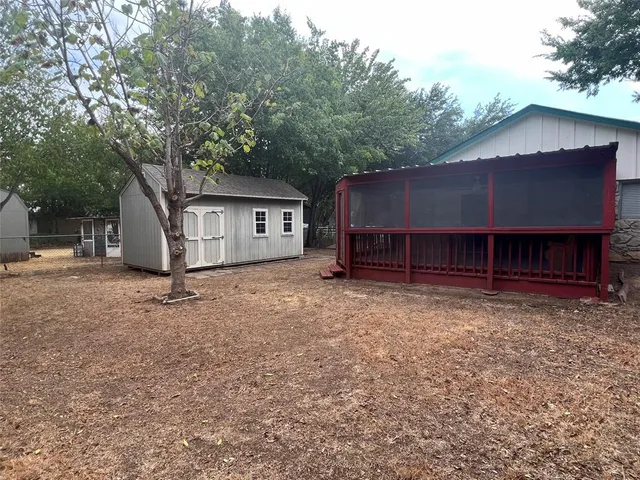 a house view with a backyard space