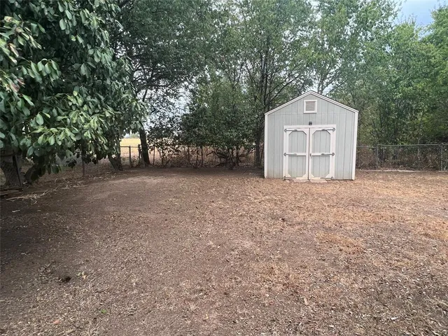 a view of a house with a trees