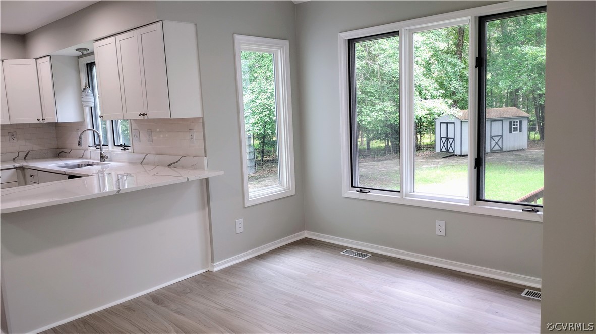 6000 Middlefield Place Chesterfield, VA 23832 - Photo 11 of 32 a view of a kitchen with wooden floor and a window