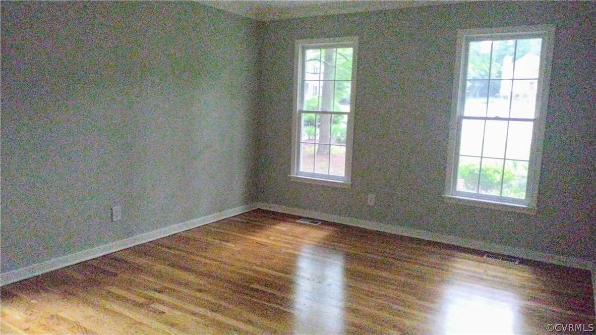 6000 Middlefield Place Chesterfield, VA 23832 - Photo 14 of 32 an empty room with wooden floor and windows