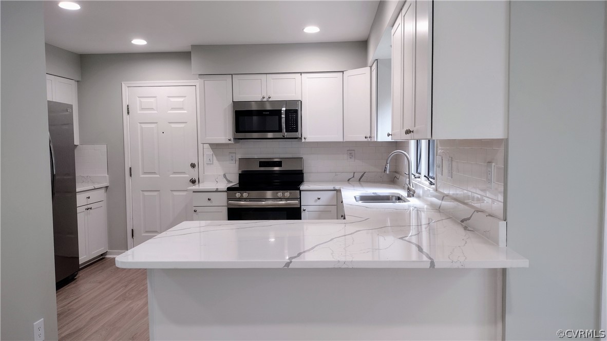 6000 Middlefield Place Chesterfield, VA 23832 - Photo 5 of 32 a kitchen with stainless steel appliances a sink a microwave a refrigerator and cabinets