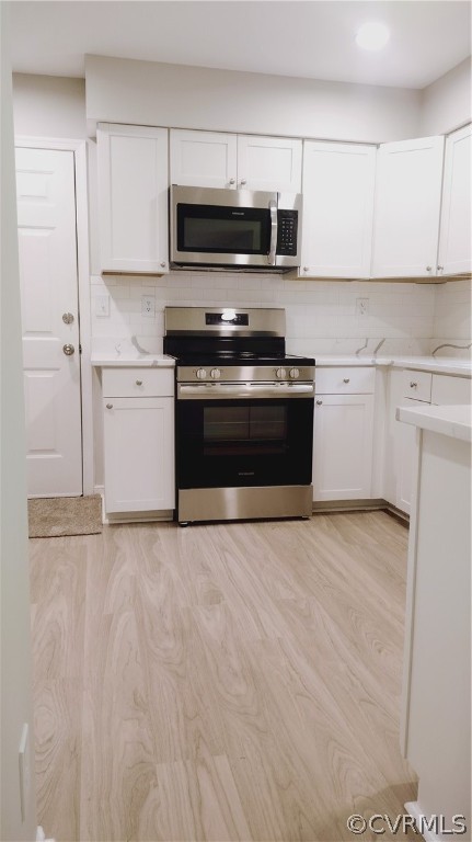 6000 Middlefield Place Chesterfield, VA 23832 - Photo 10 of 32 a kitchen with granite countertop a stove and a microwave with cabinets