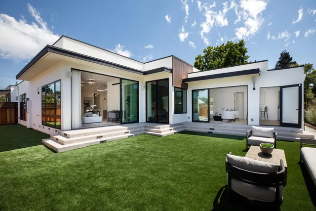 a view of an house with backyard porch and furniture