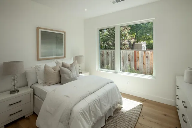 a view of a house with backyard porch and sitting area