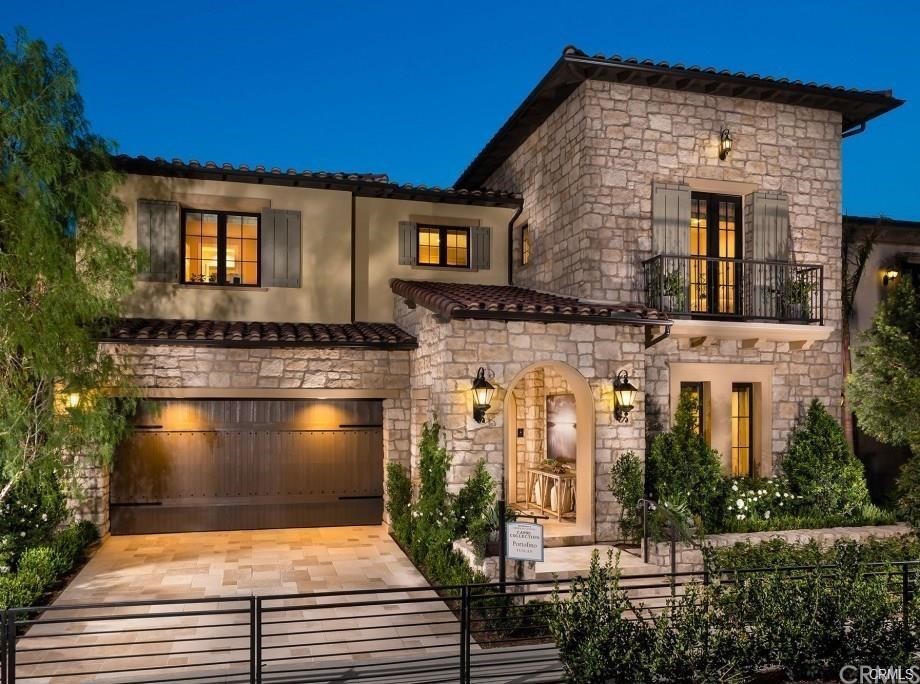 123 Amber Sky Irvine, CA 92618 - Photo 1 of 43 a view of a brick house with large windows