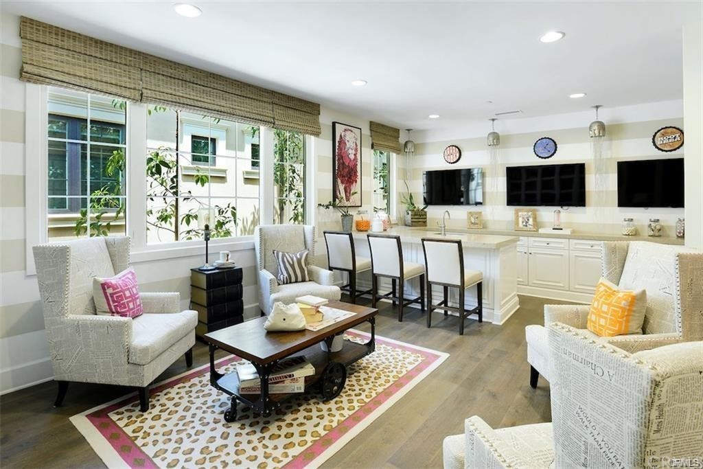 123 Amber Sky Irvine, CA 92618 - Photo 17 of 43 a living room with furniture and a flat screen tv