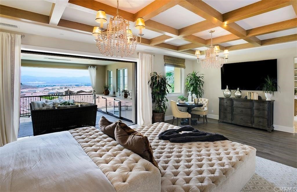 123 Amber Sky Irvine, CA 92618 - Photo 19 of 43 a living room with furniture and a flat screen tv