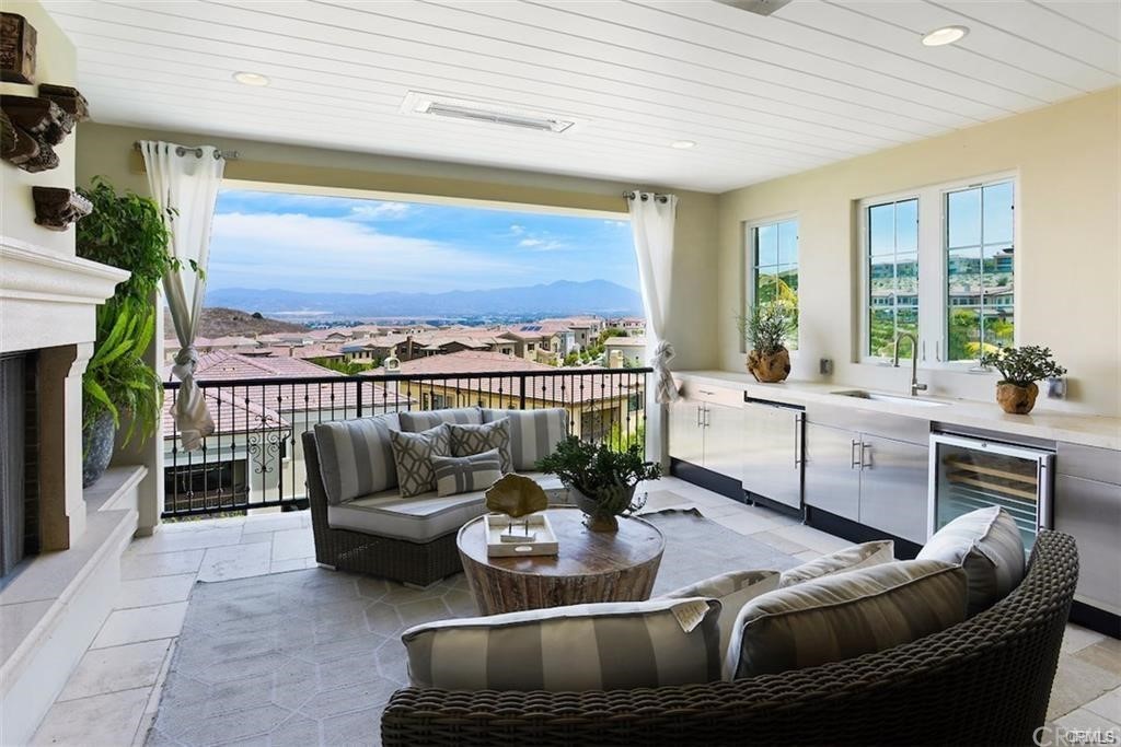 123 Amber Sky Irvine, CA 92618 - Photo 20 of 43 a living room with furniture fireplace and a large window
