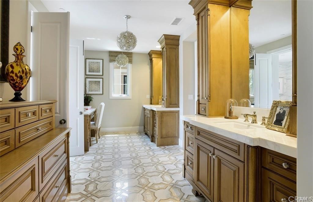 123 Amber Sky Irvine, CA 92618 - Photo 21 of 43 a bathroom with a sink a toilet and a mirror