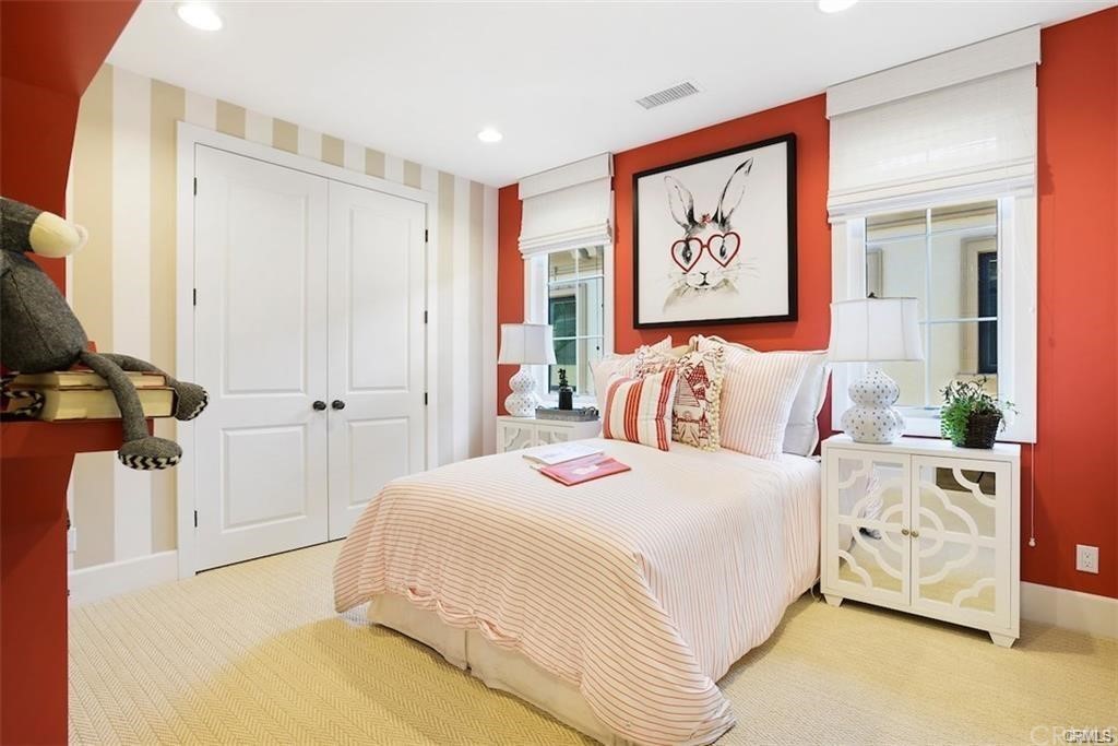 123 Amber Sky Irvine, CA 92618 - Photo 26 of 43 a bedroom with a bed and a painting on the wall