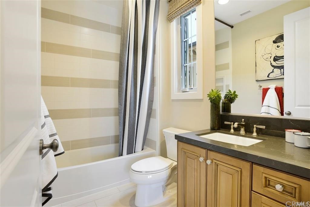 123 Amber Sky Irvine, CA 92618 - Photo 28 of 43 a bathroom with a sink toilet and shower
