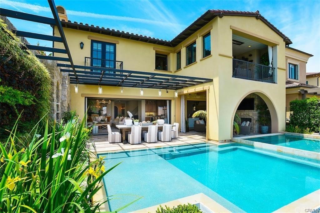 123 Amber Sky Irvine, CA 92618 - Photo 32 of 43 a view of a house with swimming pool