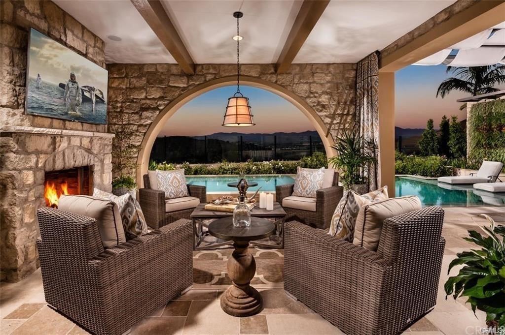 123 Amber Sky Irvine, CA 92618 - Photo 33 of 43 a living room with fireplace furniture and a fireplace