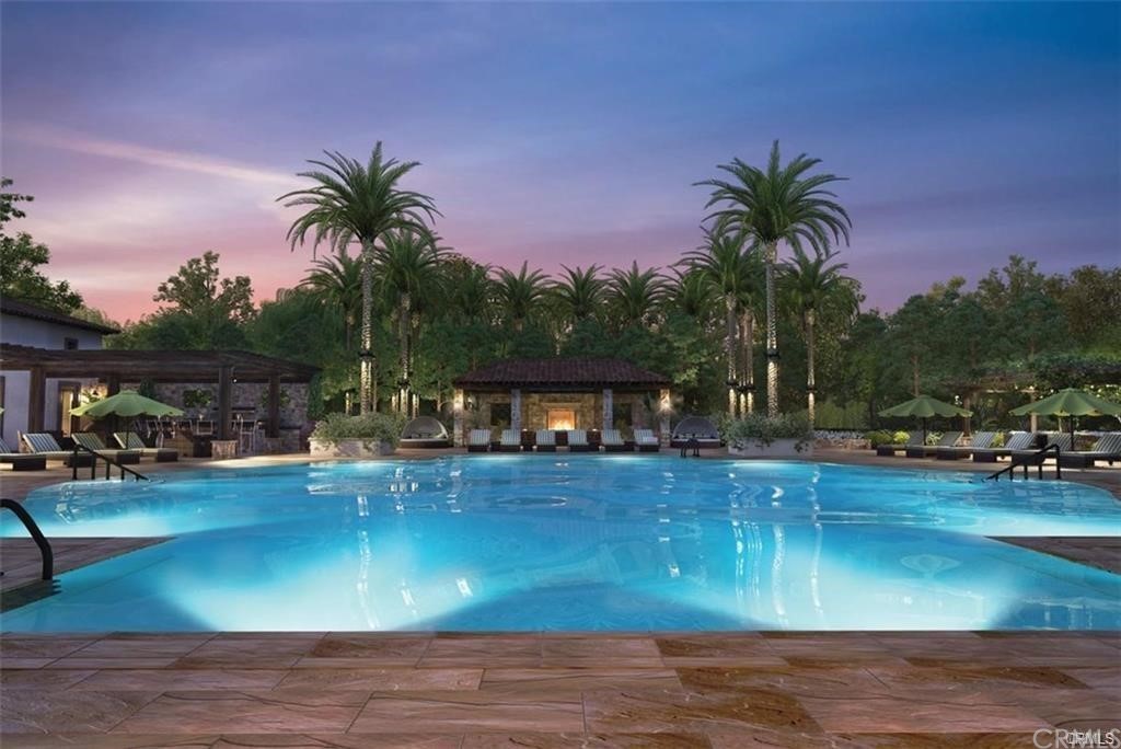 123 Amber Sky Irvine, CA 92618 - Photo 39 of 43 a view of a swimming pool with a patio